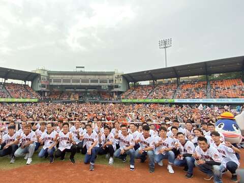 "A group photo of the team and the fans"