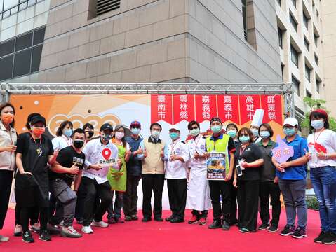 "Participating store and mayor take a group photo"